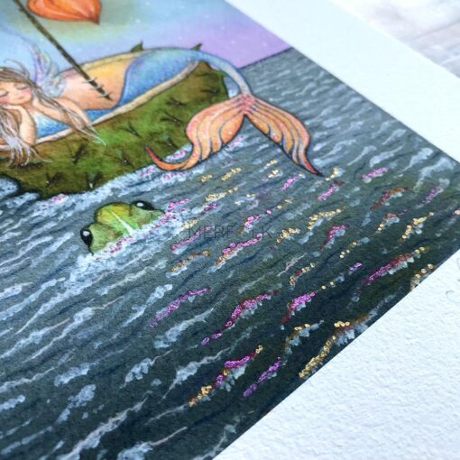 Vibrant metalic watercolour paint on the mermaid of the lakes waves