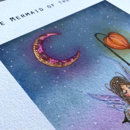 Close up of a metalic painted moon on the mermaid of the lakes print