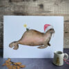 walrus in a christmas hat with a snail on his back greeting card
