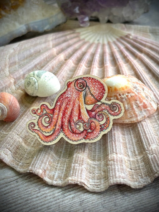 Wise orange octopus, curled octopus pin badge